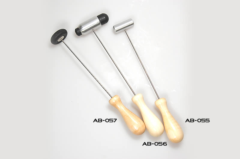 Touching hammer for tuning forks